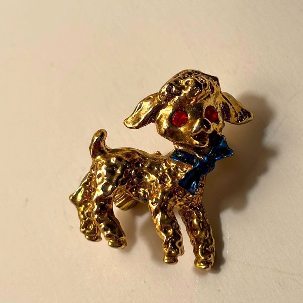 Vintage Gold Tone Lamb brooch with Red Gem eyes and blue ribbon